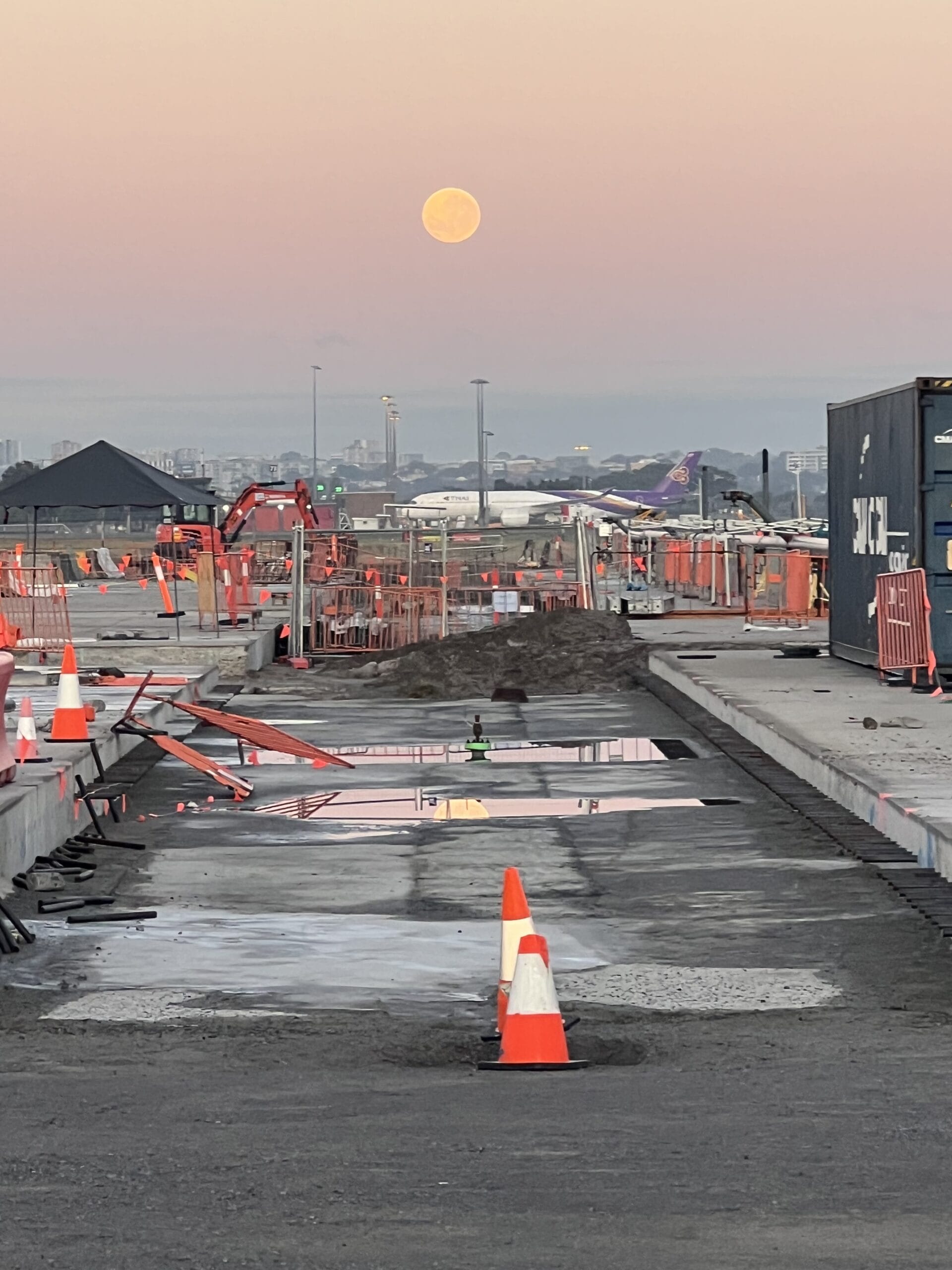 Construction zone for airport fuel system infrastructure under moonlight