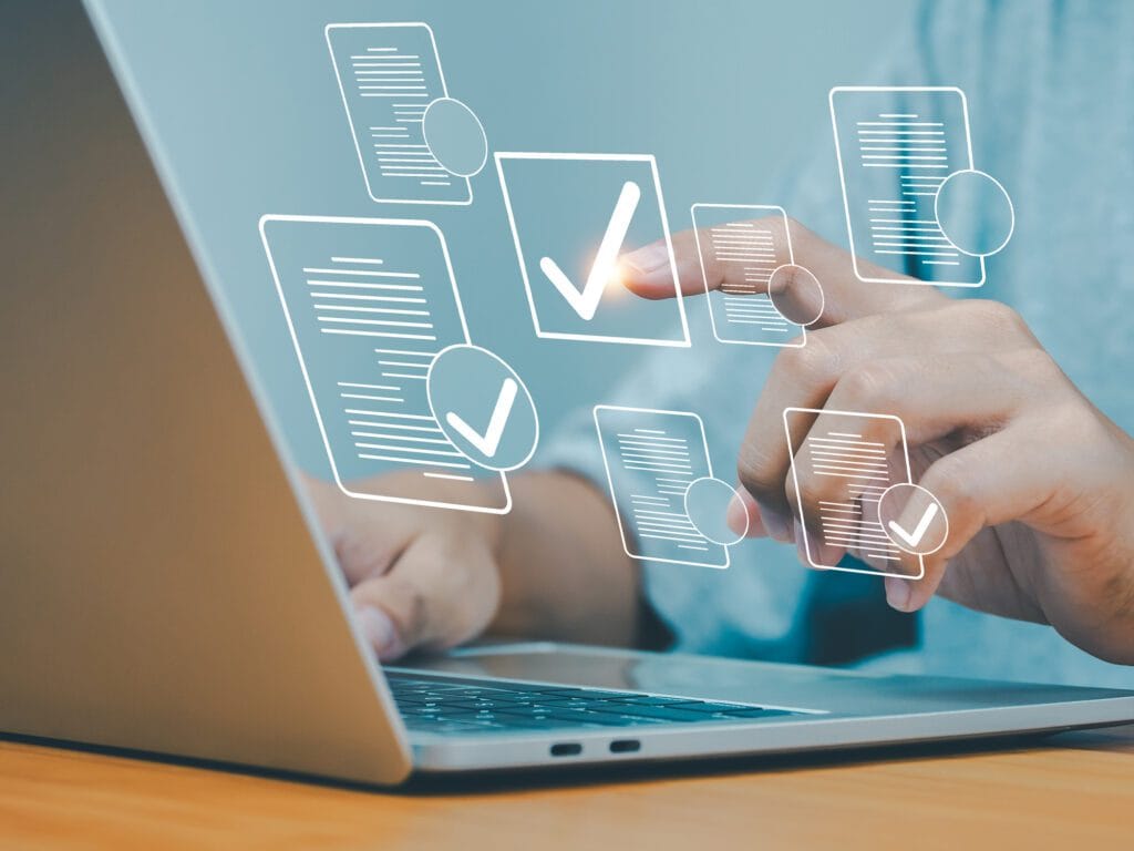 Person selecting compliance checkboxes on a digital screen